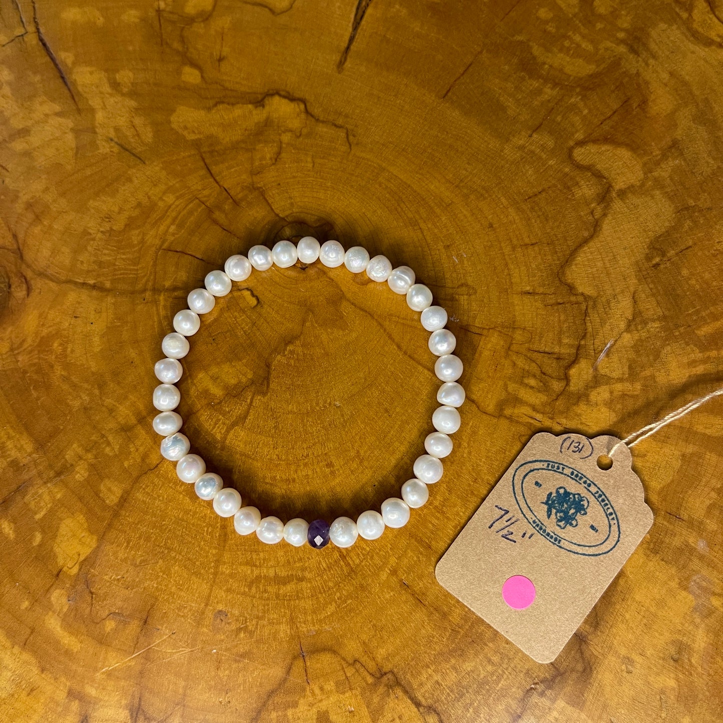 White freshwater Pearls with red faceted Jasper rondelle on elastic, 7 1/2" on wood