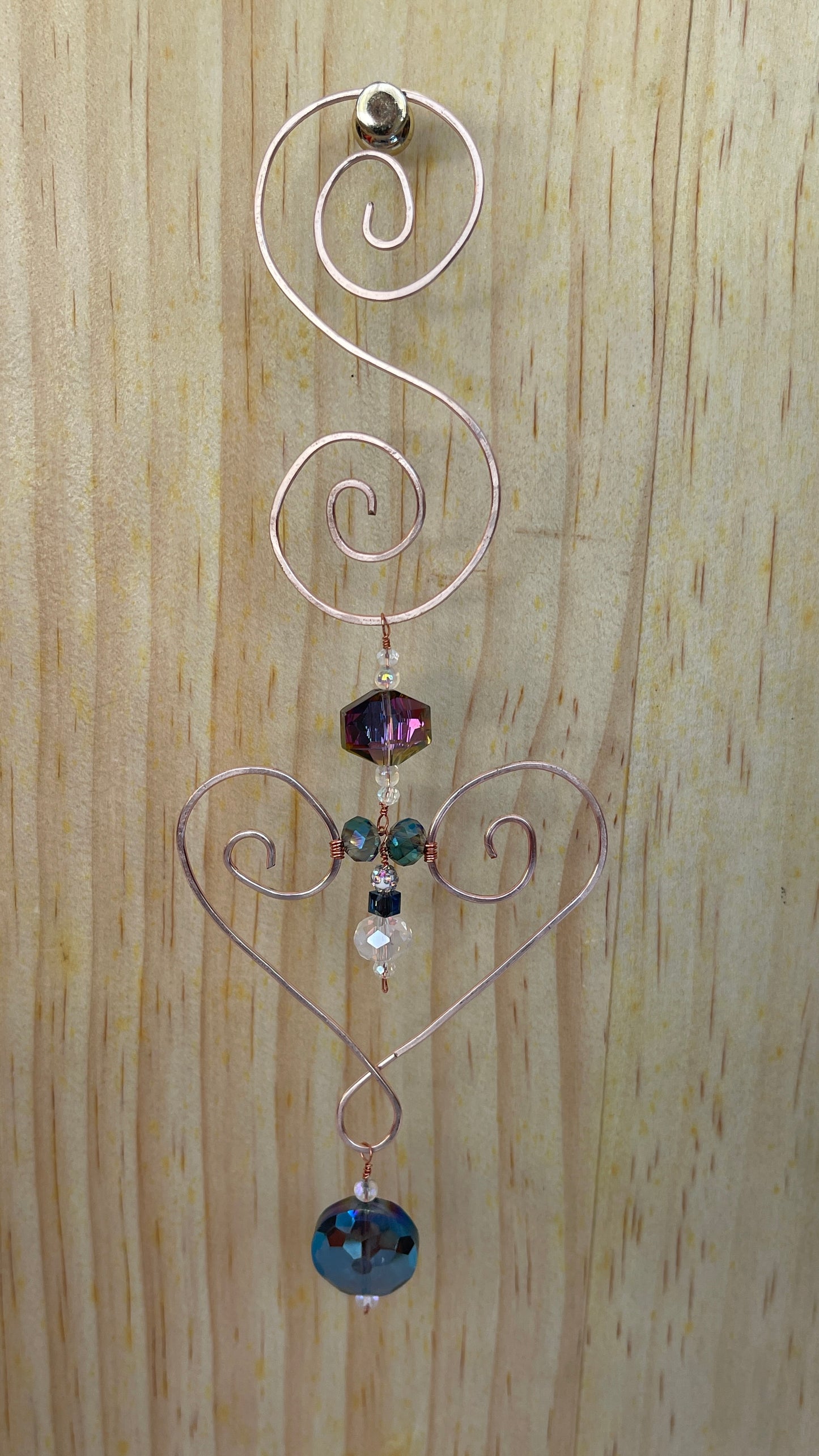 Heart shaped Decorative gold tone hammered metal wall/window Suncatcher with round rainbow crystals to clear crystal ending with a round Rainbow shaped crystal drop, 10"