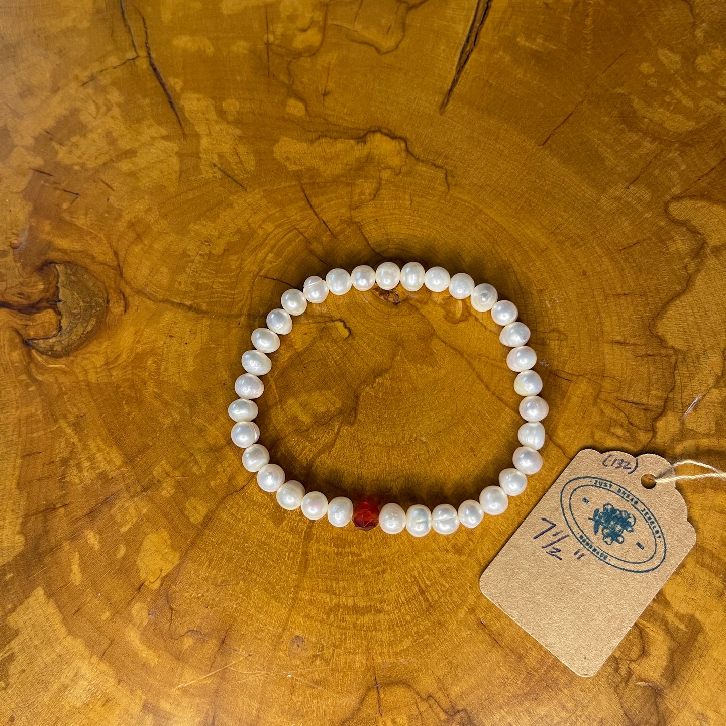 White Freshwater Pearls with faceted Carnelian on elastic, 7 1/2" on wood