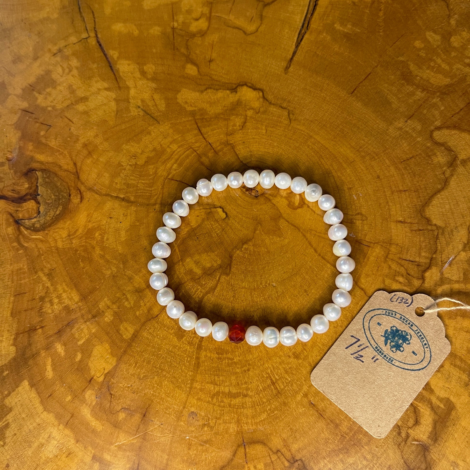 White Freshwater Pearls with faceted Carnelian on elastic, 7 1/2" on wood