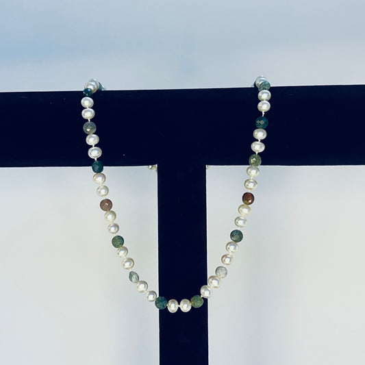 Pearl Necklace with multicolored Jasper beads on a black and white background