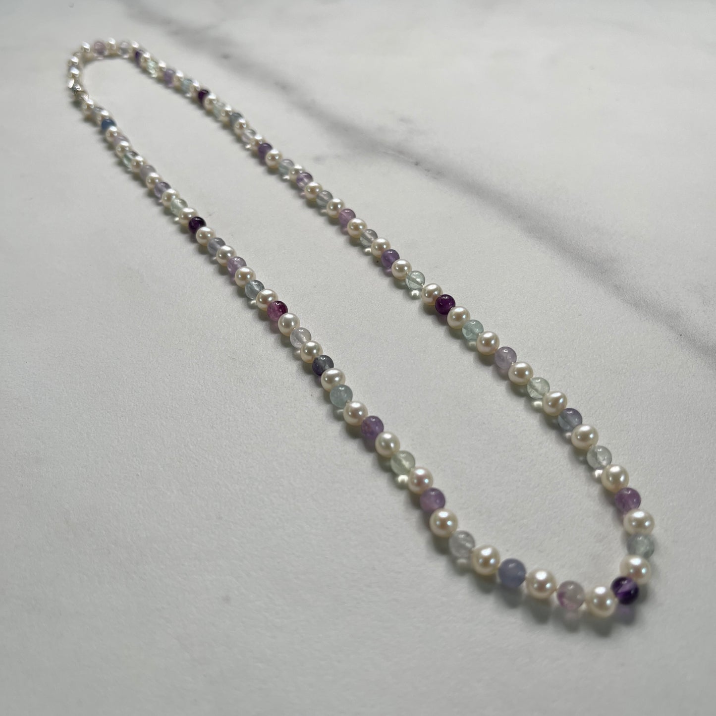 Necklace with pearls and Fluorite on a white background