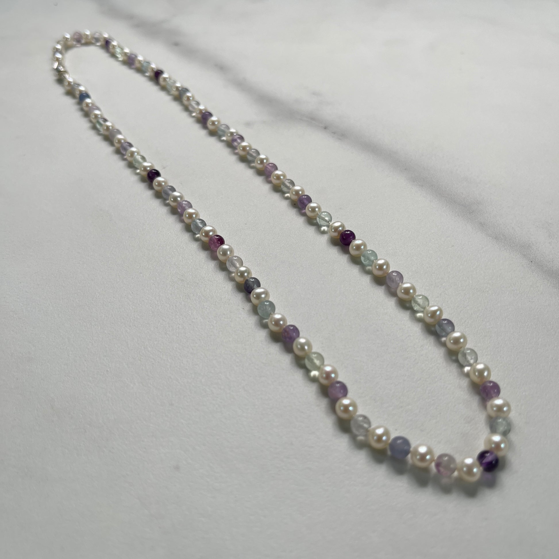 Necklace with pearls and Fluorite on a white background