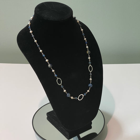 Pearls and Kyanite blue beads hand tooled on Sterling Silver wire on black mannequin bust