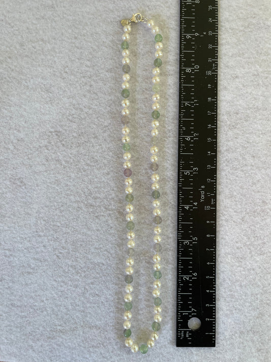 Pearl and Fluorite Necklace with a ruler for scale on a gray background