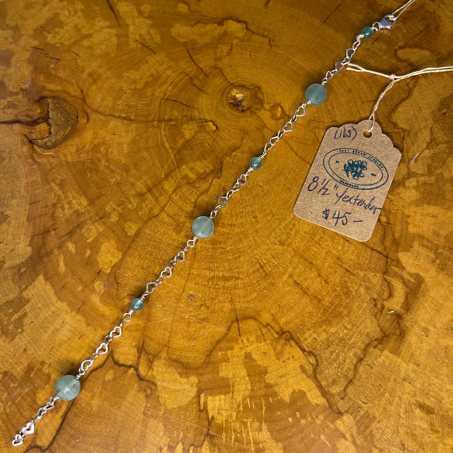 Aventurine on Sterling Silver heart Chain,8 inch with 1/2 inch extender and Sterling silver Lobster clasp on wooden surface with tag
