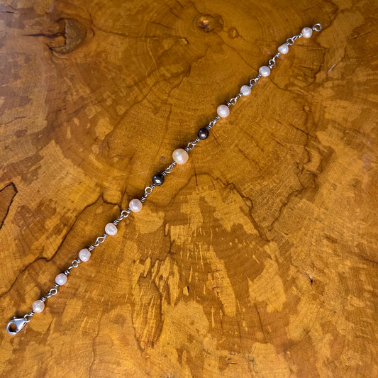 Freshwater White, Mauve and Peacock Pearls on Sterling Silver wire with Sterling Silver Lobster clasp, 8" on wood