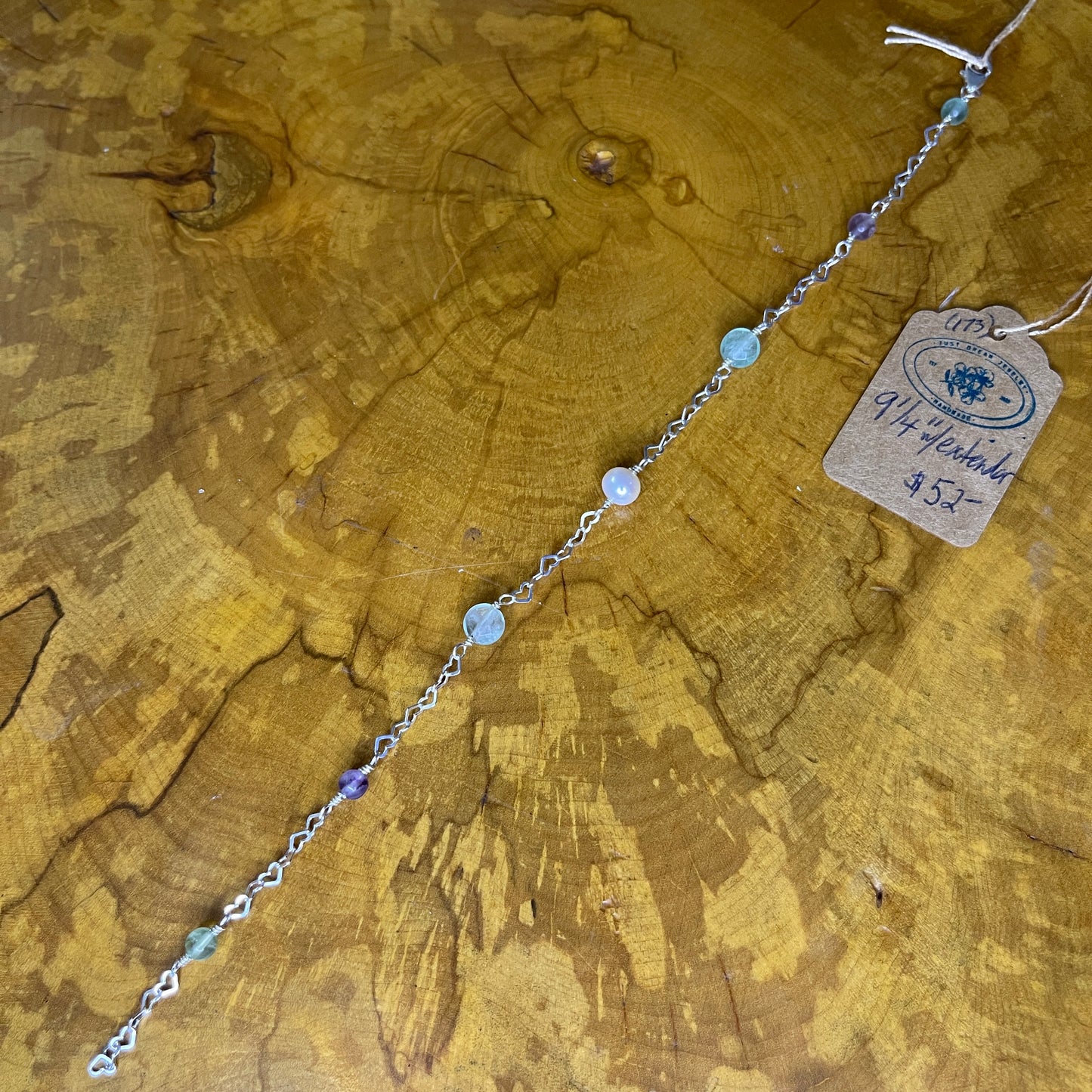 Fluorite and Freshwater Pearl on Sterling Silver Heart chain, 9 inch with 1/2 inch extender and Sterling Silver Lobster clasp on wooden surface with tag