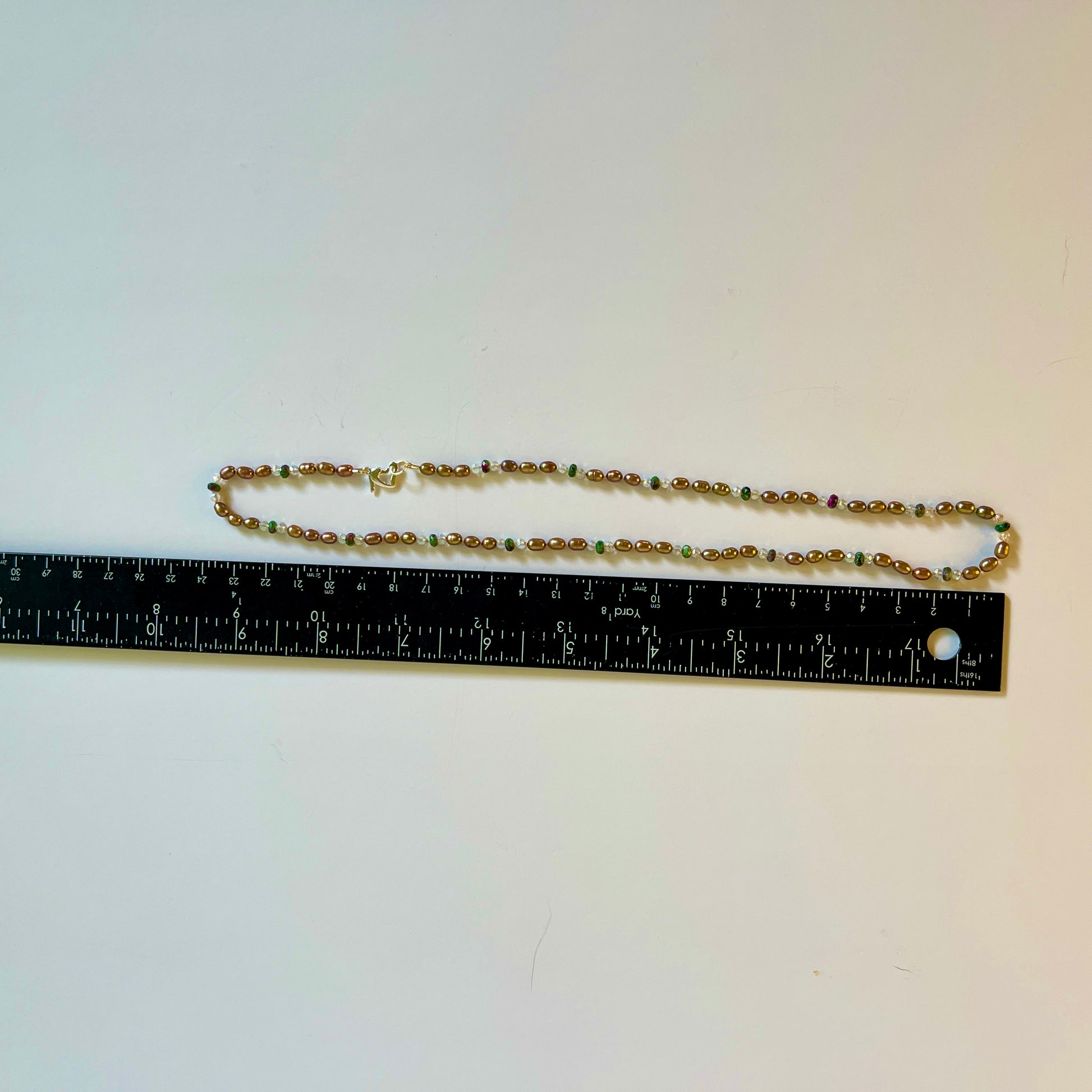 Chocolate Pearls,crystal and green jasper necklace with a ruler for scale on a white background