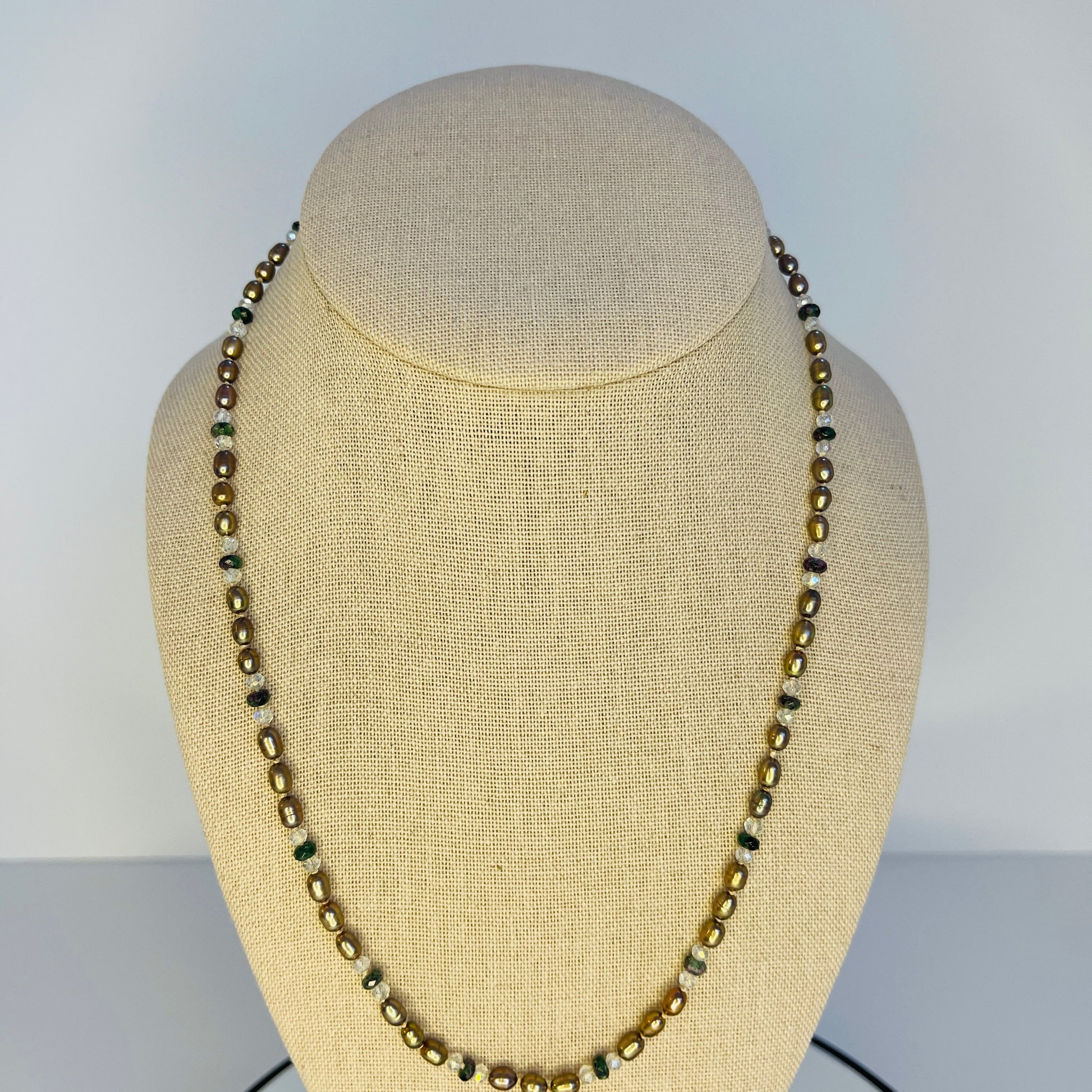 Chocolate Pearl ,crystal and green Jasper Necklace on a mannequin bust with a plain background