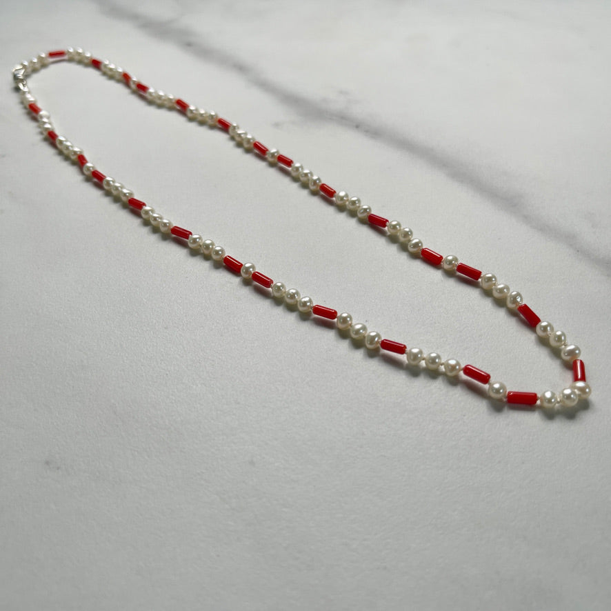 Coral and Pearl necklace on marble
