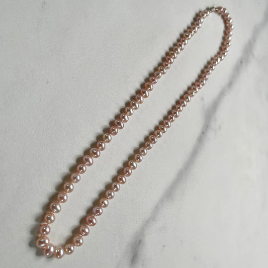 Pink Pearl necklace on marble