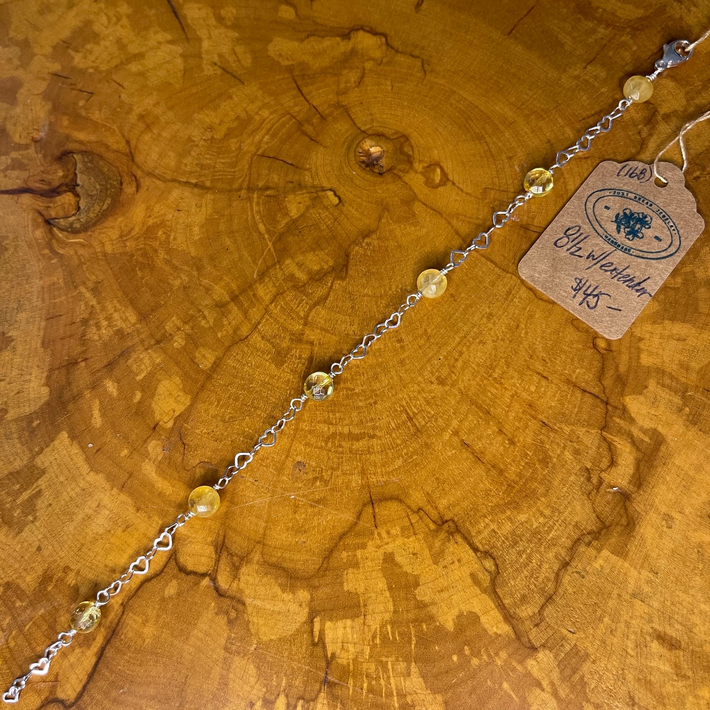 Sterling Silver heart Chain with faceted Citrine, 8 1/2" with Sterling Heart extender, Sterling Silver Heart Lobster Clasp on wooden slab