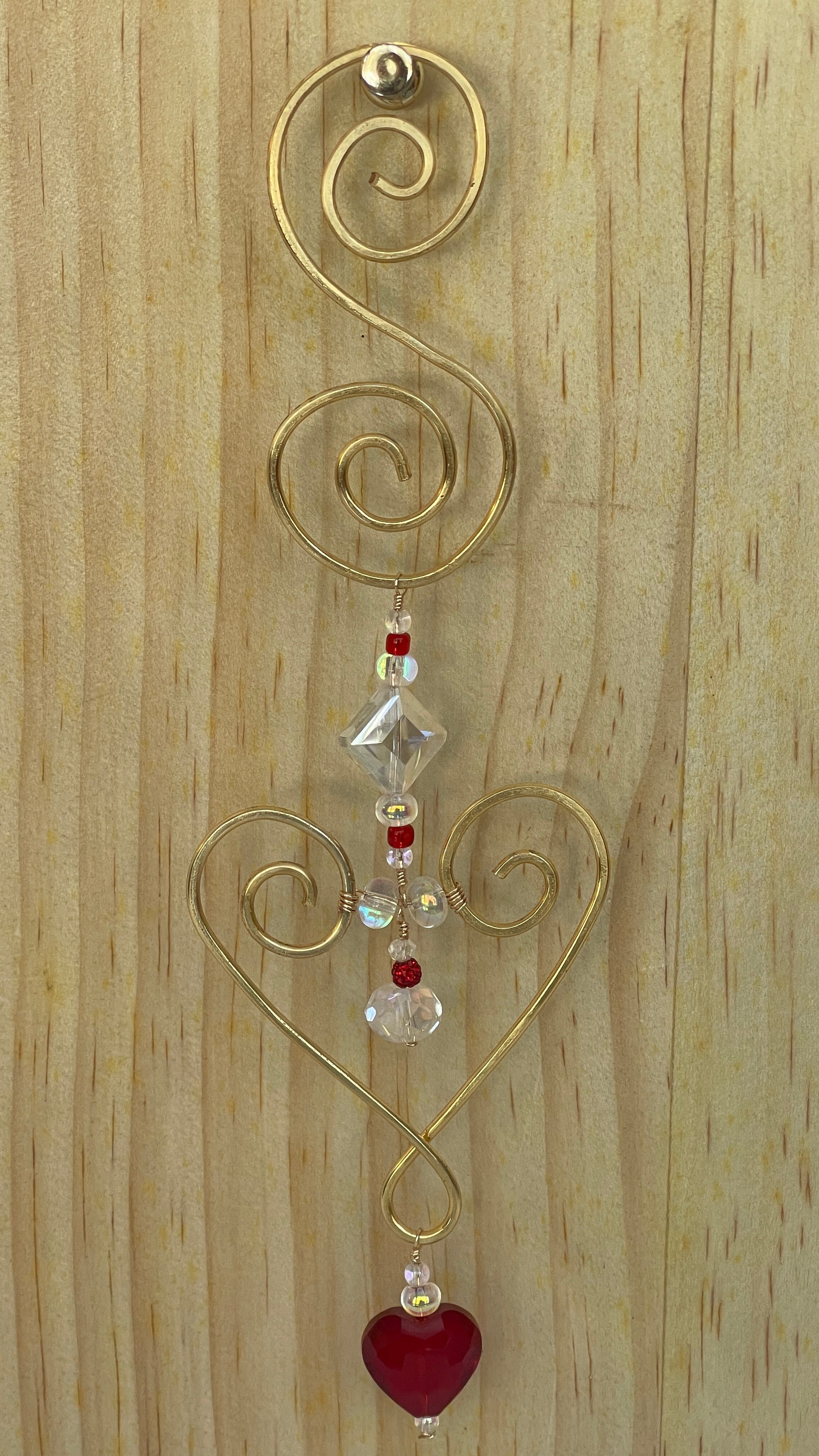 Heart shaped Decorative gold tone hammered metal wall/window Suncatcher with Red heart shaped crystal drop, 10"