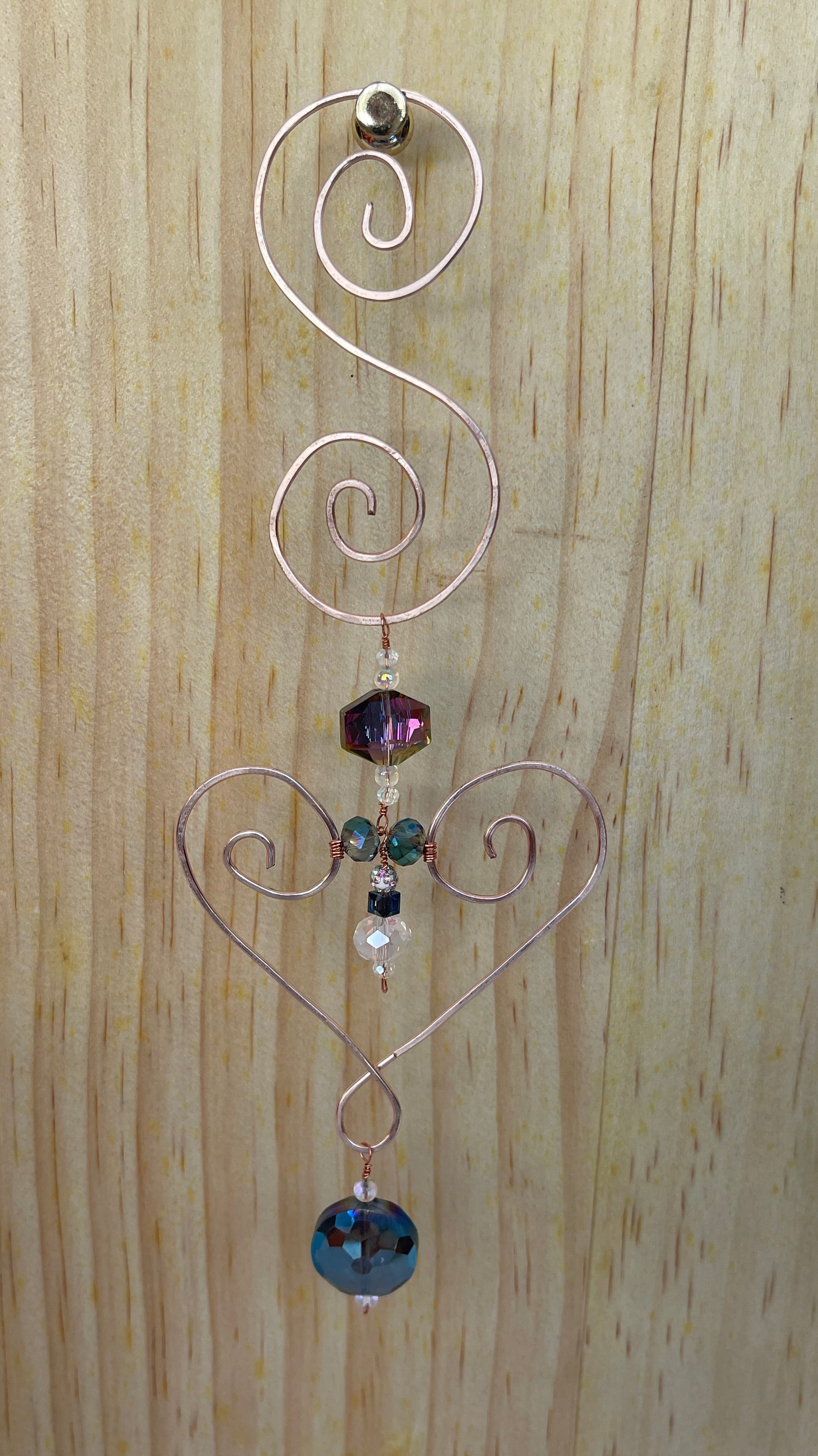 Heart shaped Decorative gold tone hammered metal wall/window Suncatcher with round rainbow crystals to clear crystal ending with a round Rainbow shaped crystal drop, 10"