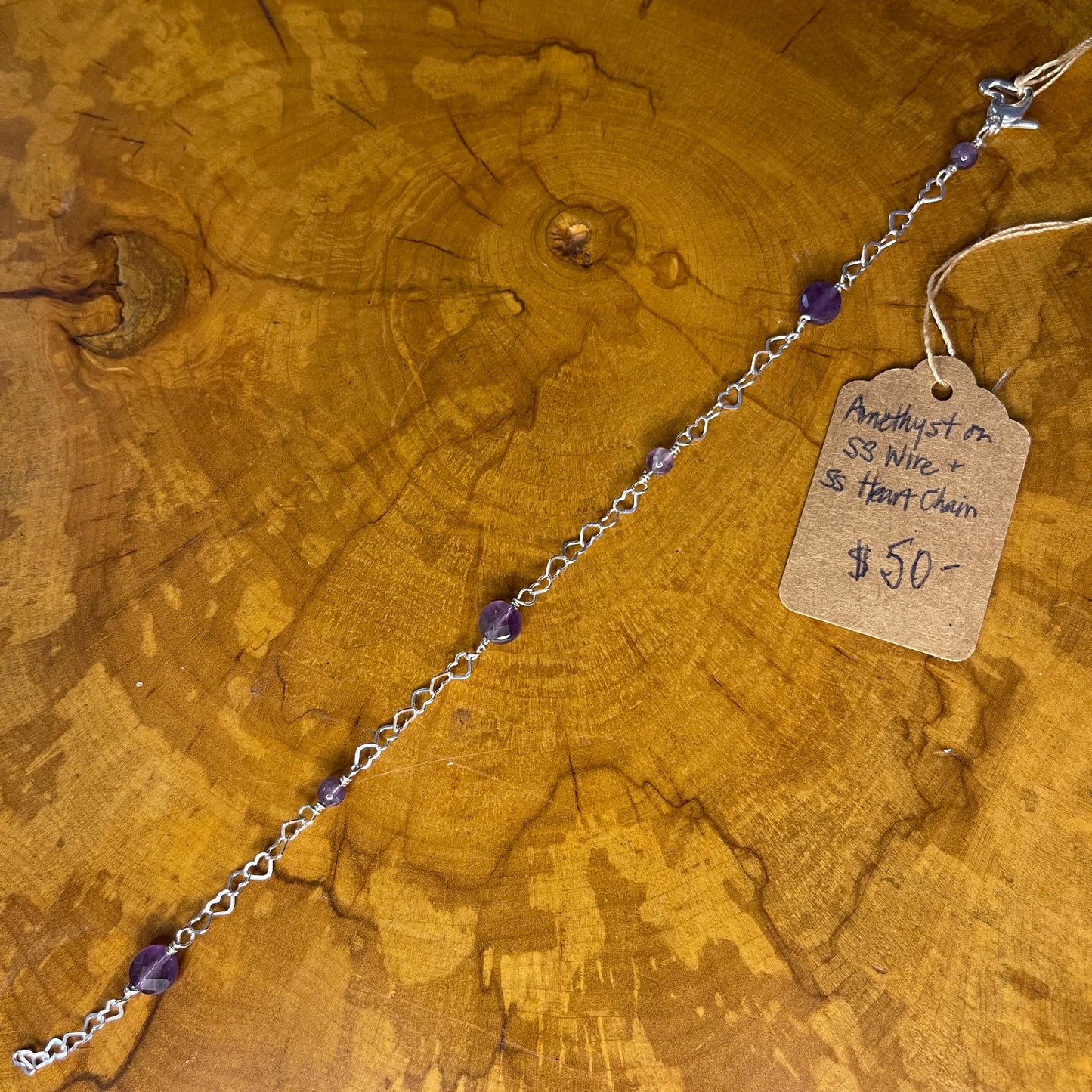 Sterling Silver heart Chain with faceted Amethyst, 8 1/2" with Sterling Heart extender, Sterling Silver Heart Lobster Clasp on wooden slab