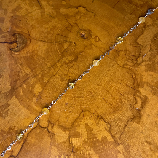 Sterling Silver heart Chain with faceted Citrine, 8 1/2" with Sterling Heart extender, Sterling Silver Heart Lobster Clasp on wooden slab