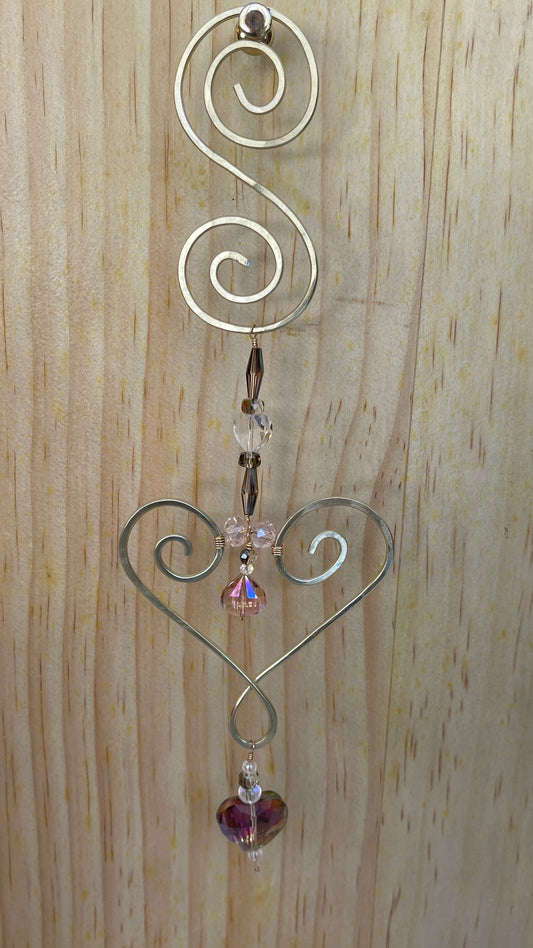 Heart shaped Decorative gold tone hammered metal wall/window Suncatcher with oblong rainbow crystals to clear crystal ending with a  Rainbow Heart shaped crystal drop, 10"