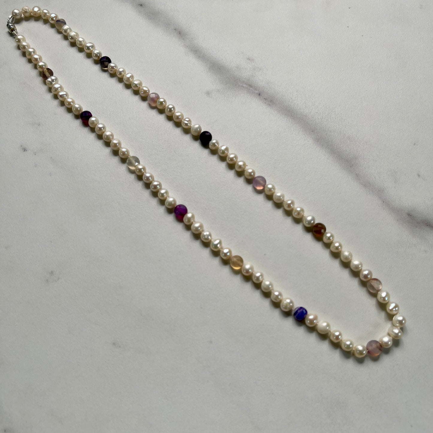 Pearl  and purple marbled jasper necklace on marble